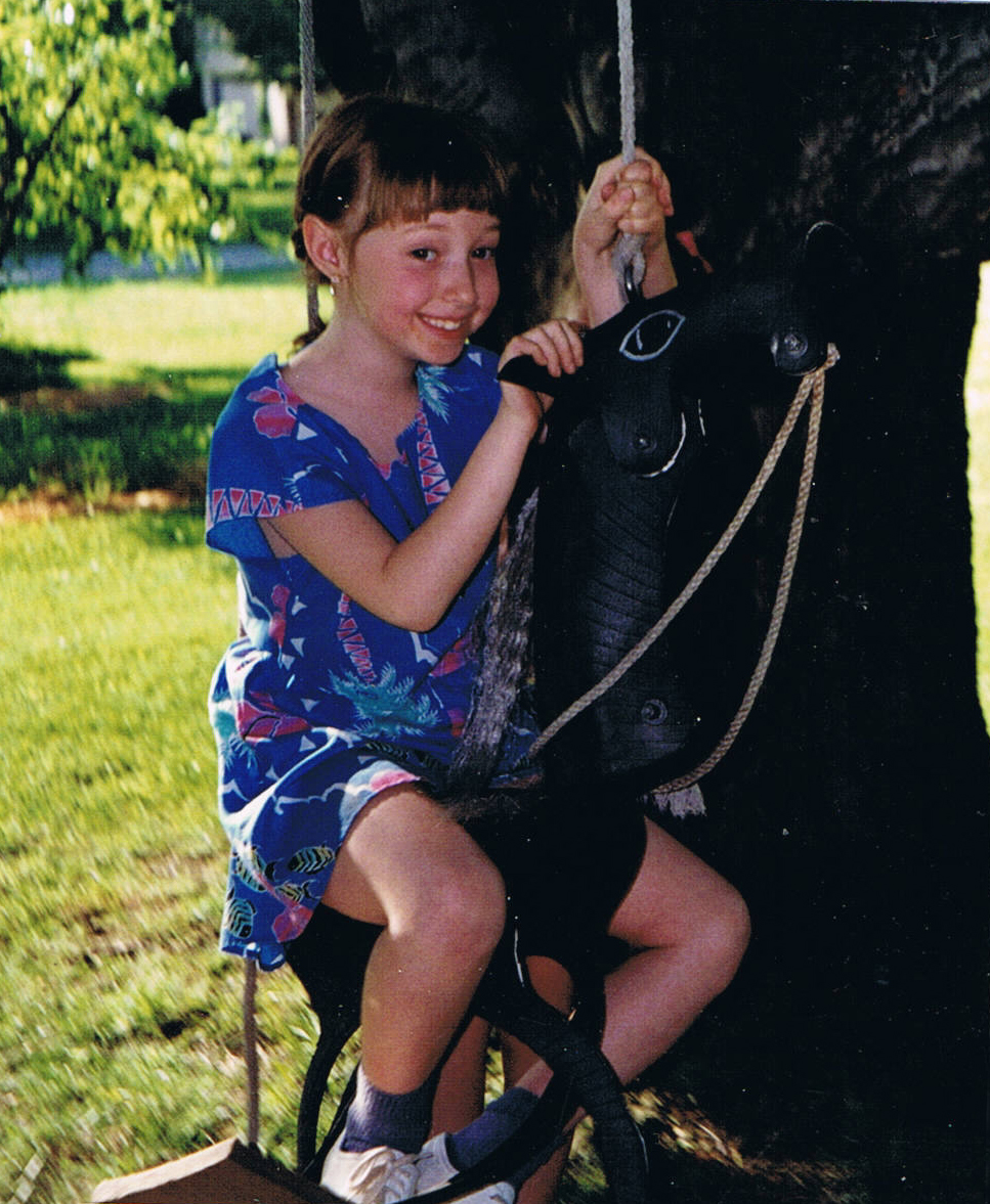 Young Juliana swings at her grandfather's home in Pennsylvania. Photo by Carr family member